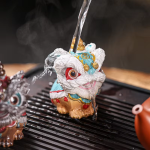 Dansande lejon tea pet i resin