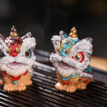Dansande lejon tea pet i resin