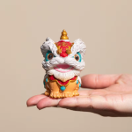Dansande lejon tea pet i resin