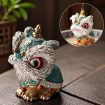 Dansande lejon tea pet i resin — Turkos