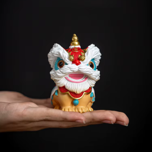 Figurer i kinesisk stil föreställande lejon i resin