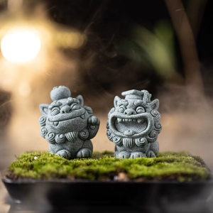Kinesiska skyddsfigurer i sten föreställande lejon