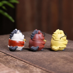 Lyckogris tea pet i Yixinglera