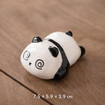 Pandafigur som tea pet i keramik — Liggande, spiralformade ögon