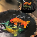 Tea pet-fiskar i resin med färgskiftande effekt — Orange och turkosgrönt par