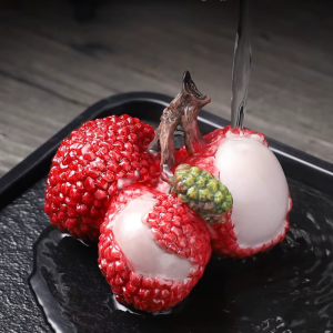 Tea pet med färgskiftande litchi i resin