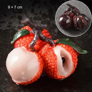 Tea pet med färgskiftande litchi i resin — Orange-röd