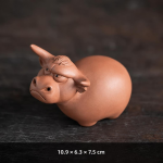 Tea pet med tjurmotiv av lila lera