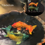 Tea pet som byter färg i resin — Två orange och gröna fiskar